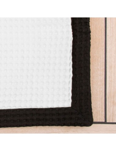 Customizable bath mat made of gray waffle weave with white waffle weave edge