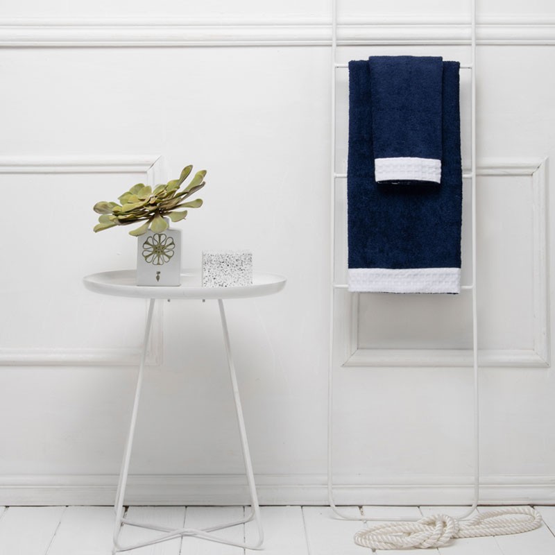 A pair of terry cloth towels with waffle weave edge