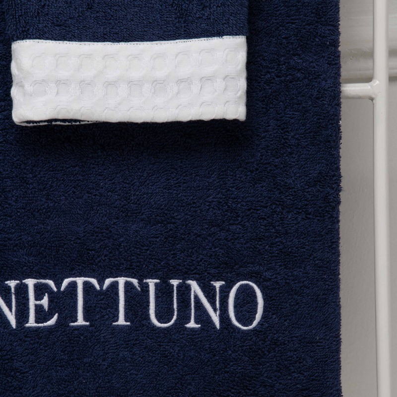 A pair of terry cloth towels with waffle weave edge