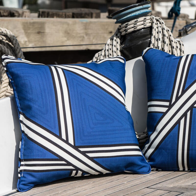 Blue outdoor cushion with graphic cross pattern