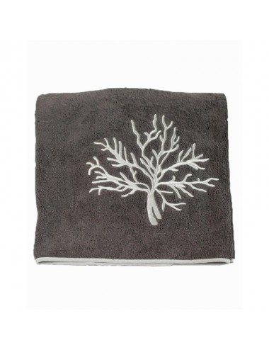 Beach towel made of sand-colored terry cloth with gray coral embroidery